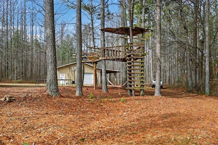 1800 Mandeville Road Bremen, GA 30110 - Photo 17 of 45 a backyard of a house with table and chairs
