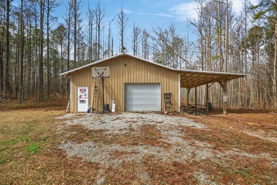 1800 Mandeville Road Bremen, GA 30110 - Photo 18 of 45 a front view of a house with a yard and garage