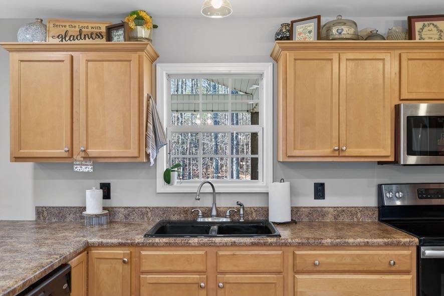 1800 Mandeville Road Bremen, GA 30110 - Photo 22 of 45 a kitchen with granite countertop a sink and a window