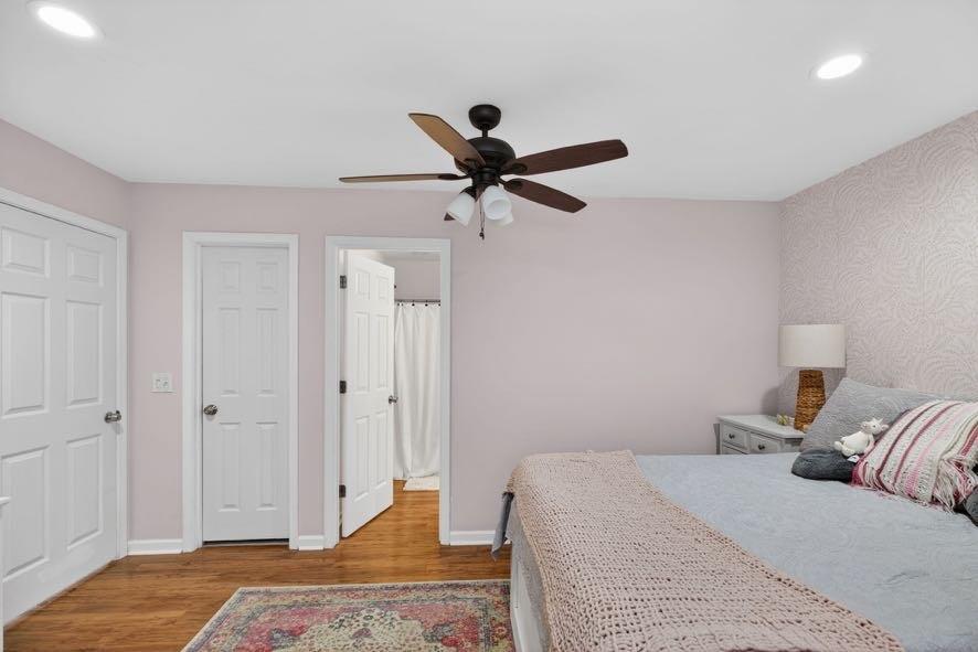 1800 Mandeville Road Bremen, GA 30110 - Photo 28 of 45 a bedroom with a bed and a chandelier