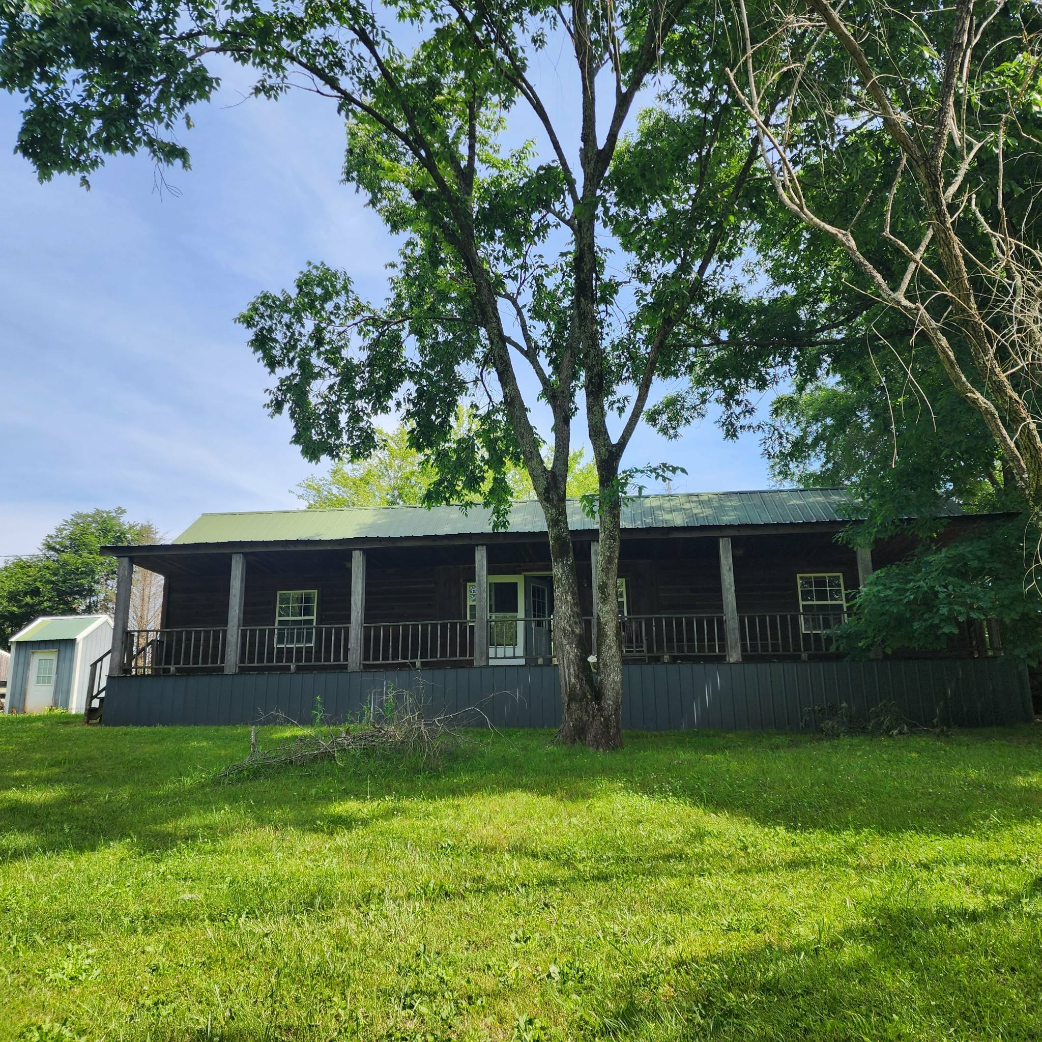145 Mrs Gower Road Lawrenceburg, TN 38464 - Photo 2 of 26 a front view of house with yard and outdoor seating