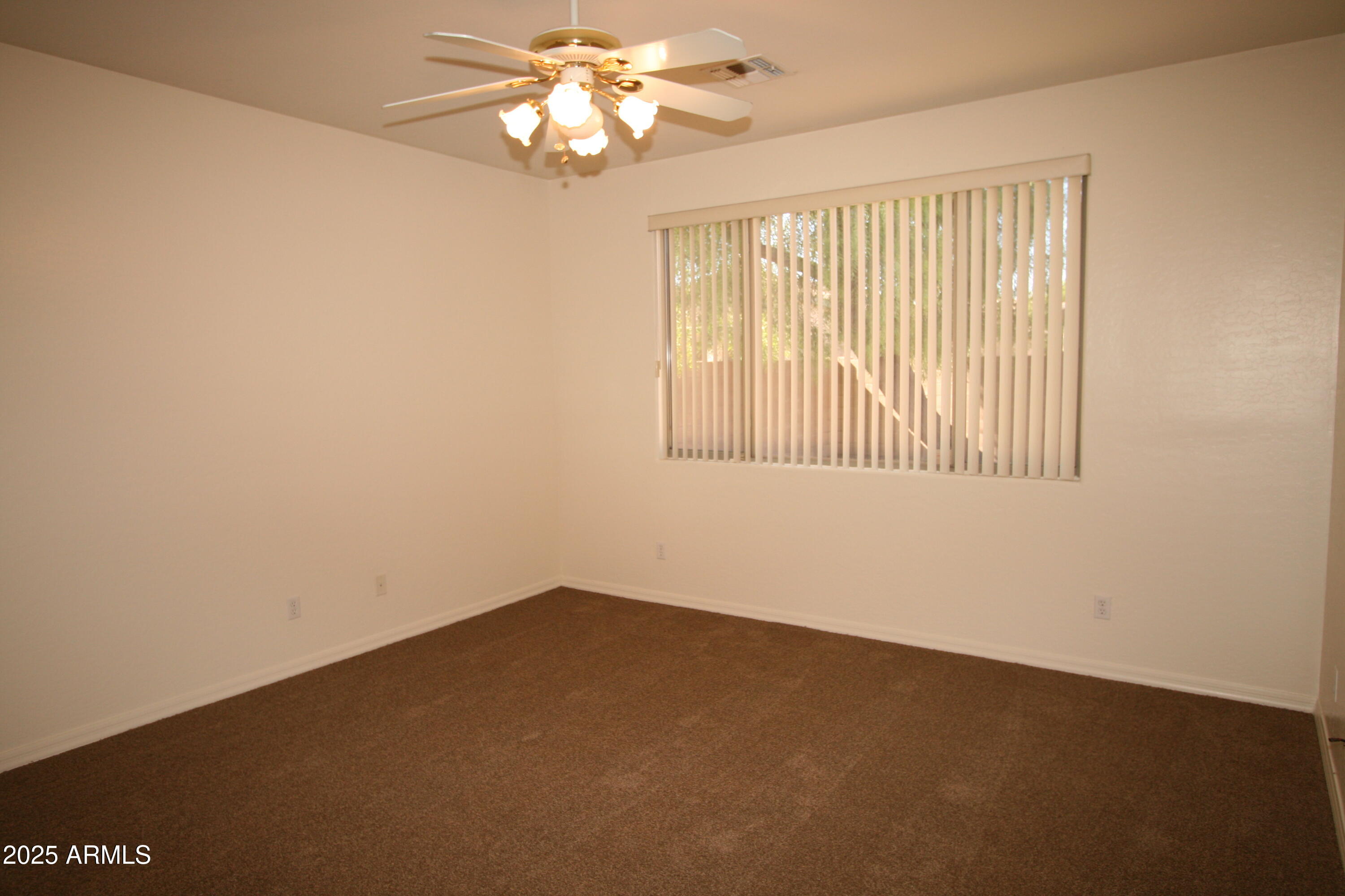 14298 West Verde Lane Goodyear, AZ 85395 - Photo 12 of 21 an empty room with a window