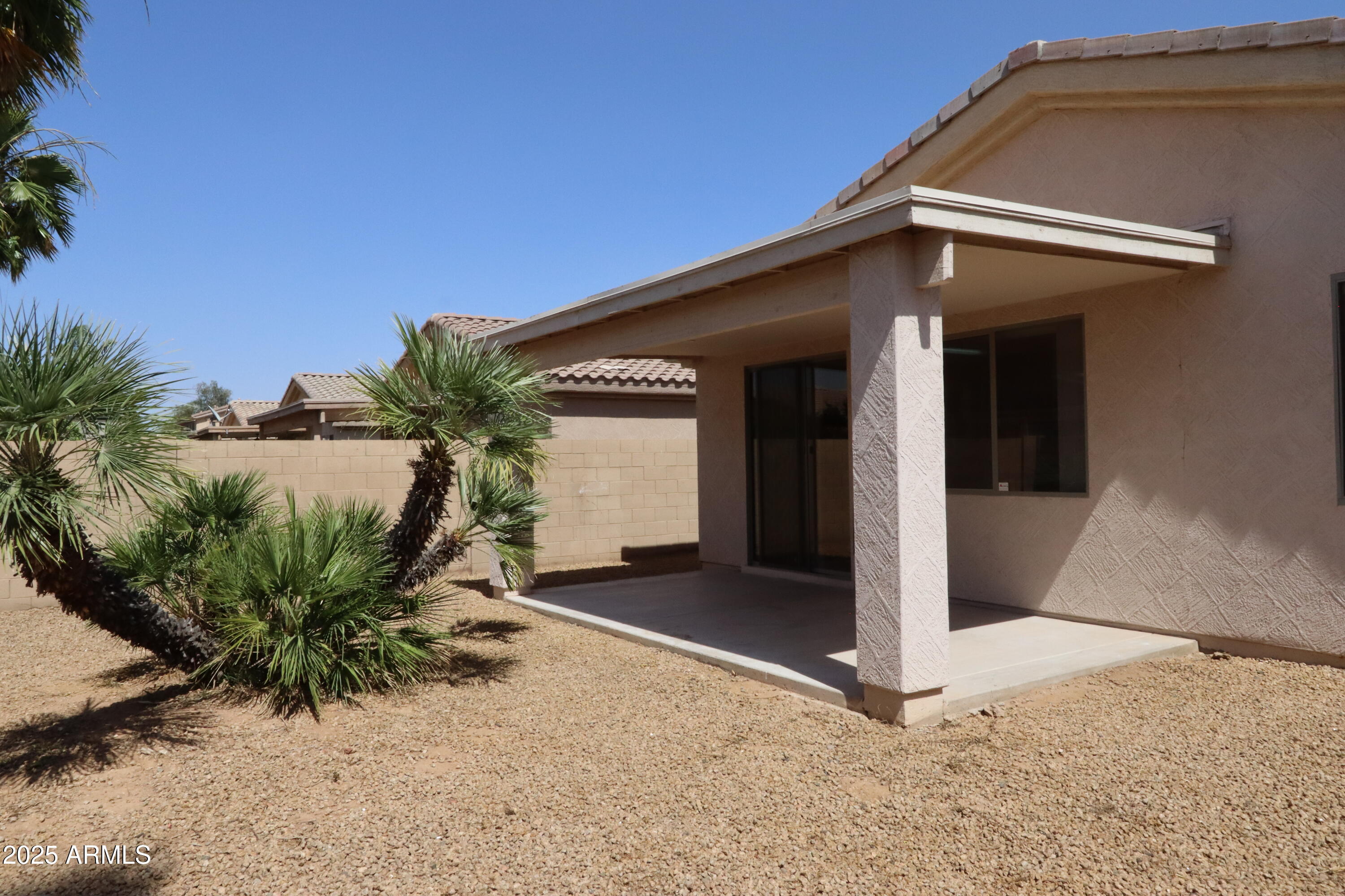 14298 West Verde Lane Goodyear, AZ 85395 - Photo 19 of 21 a front view of a house with a yard
