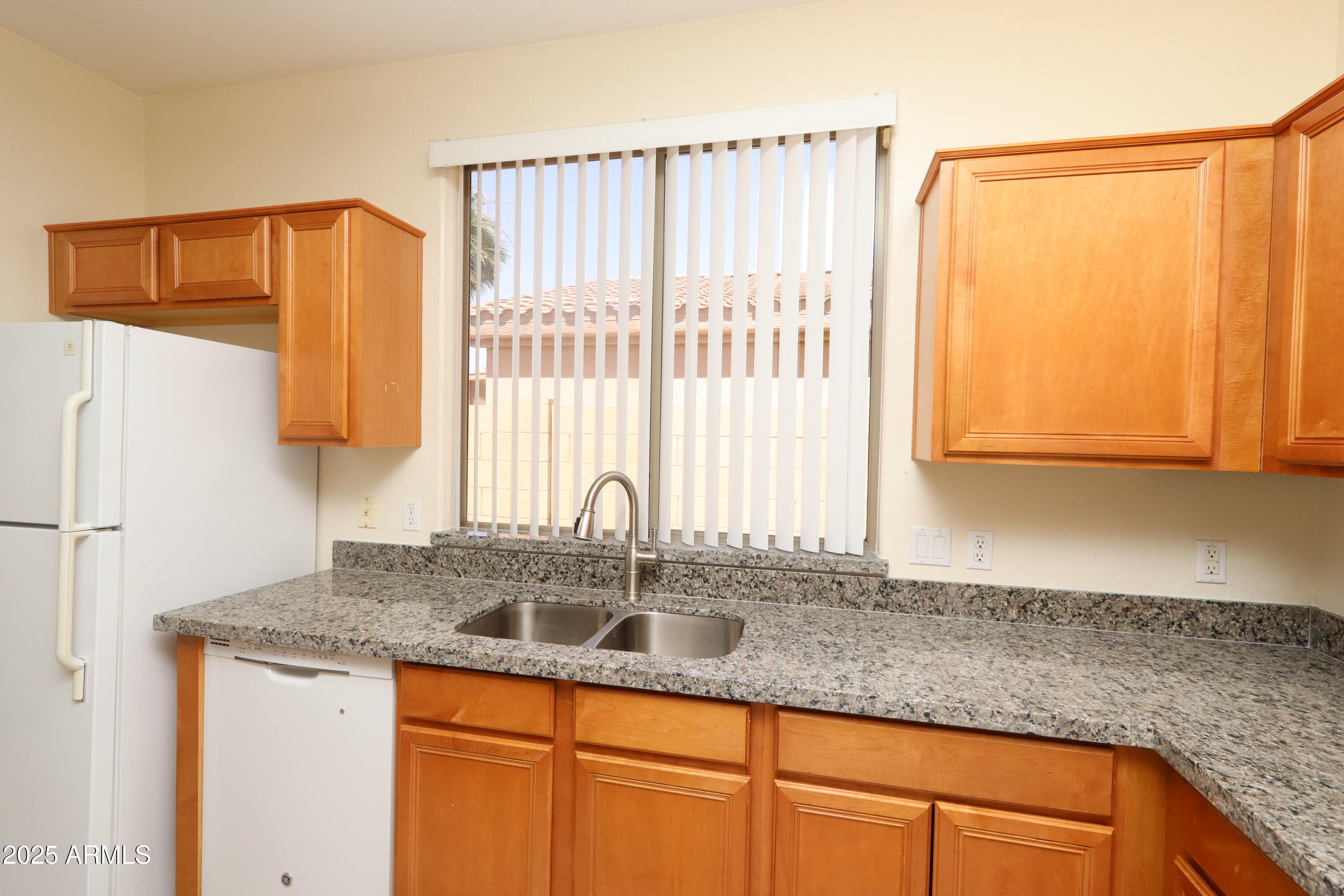 14298 West Verde Lane Goodyear, AZ 85395 - Photo 6 of 21 a kitchen with stainless steel appliances granite countertop a sink and a counter space