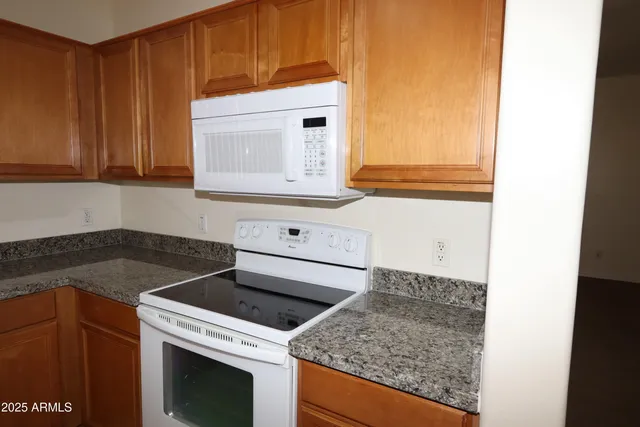 a kitchen that has a sink and a stove