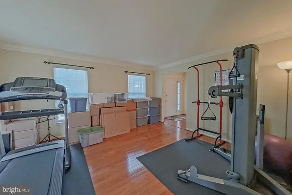 a view of a kitchen with refrigerator and workspace