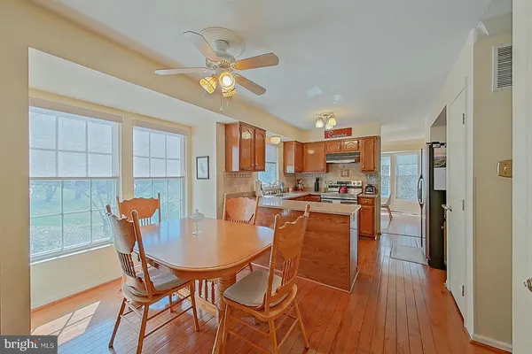 a dining room with furniture and a chandelier