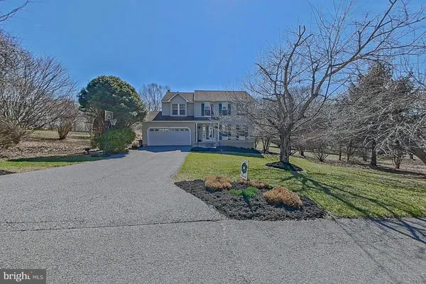 a view of a big yard in front of a house