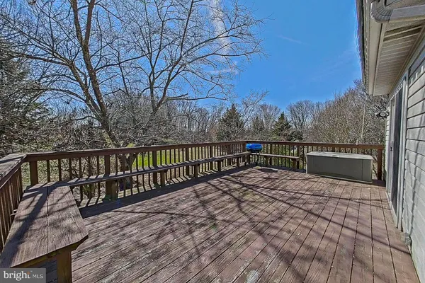 a view of a two chairs on the roof deck