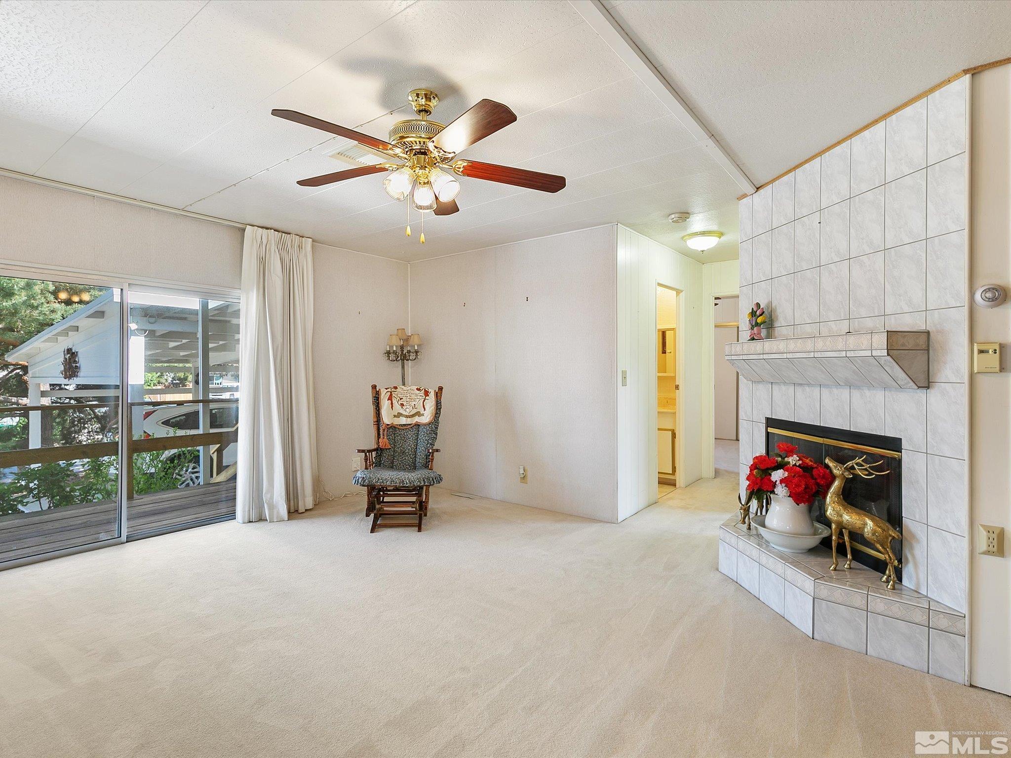 15010 Vega Street Reno, NV 89521 - Photo 15 of 30 a living room with furniture and a fireplace