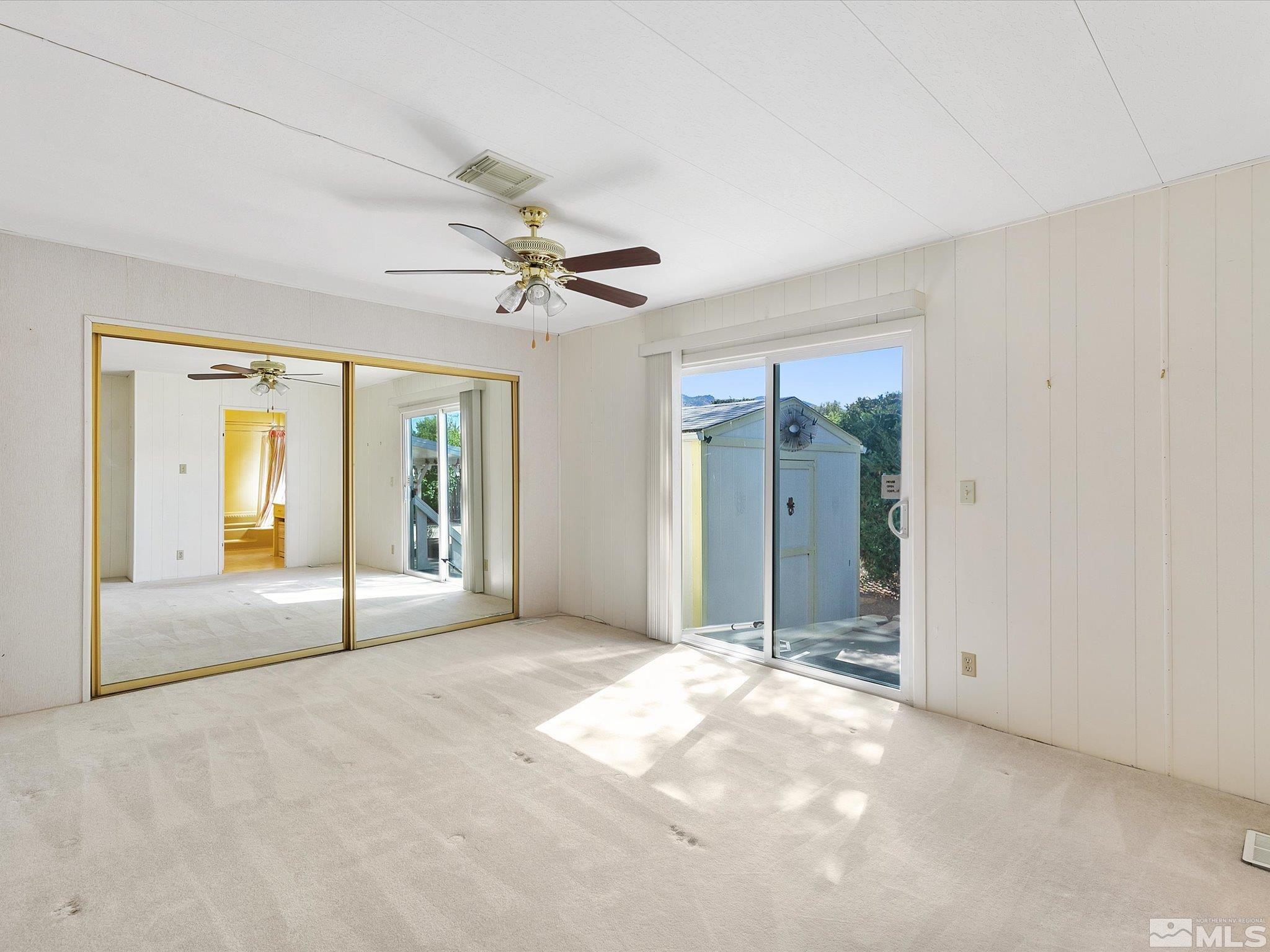 15010 Vega Street Reno, NV 89521 - Photo 17 of 30 a view of a livingroom with a ceiling fan and window
