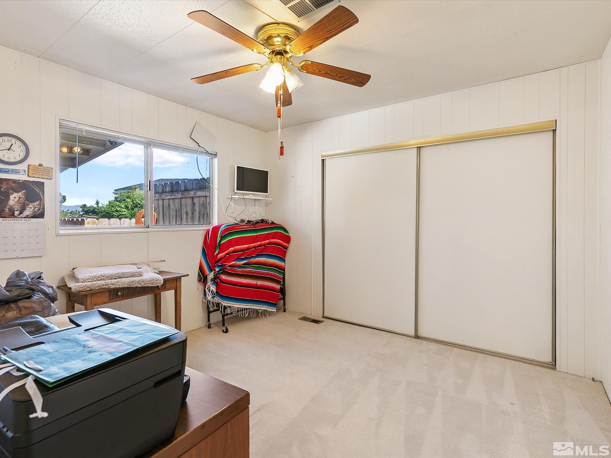 15010 Vega Street Reno, NV 89521 - Photo 22 of 30 a view of a workspace with furniture and a chandelier