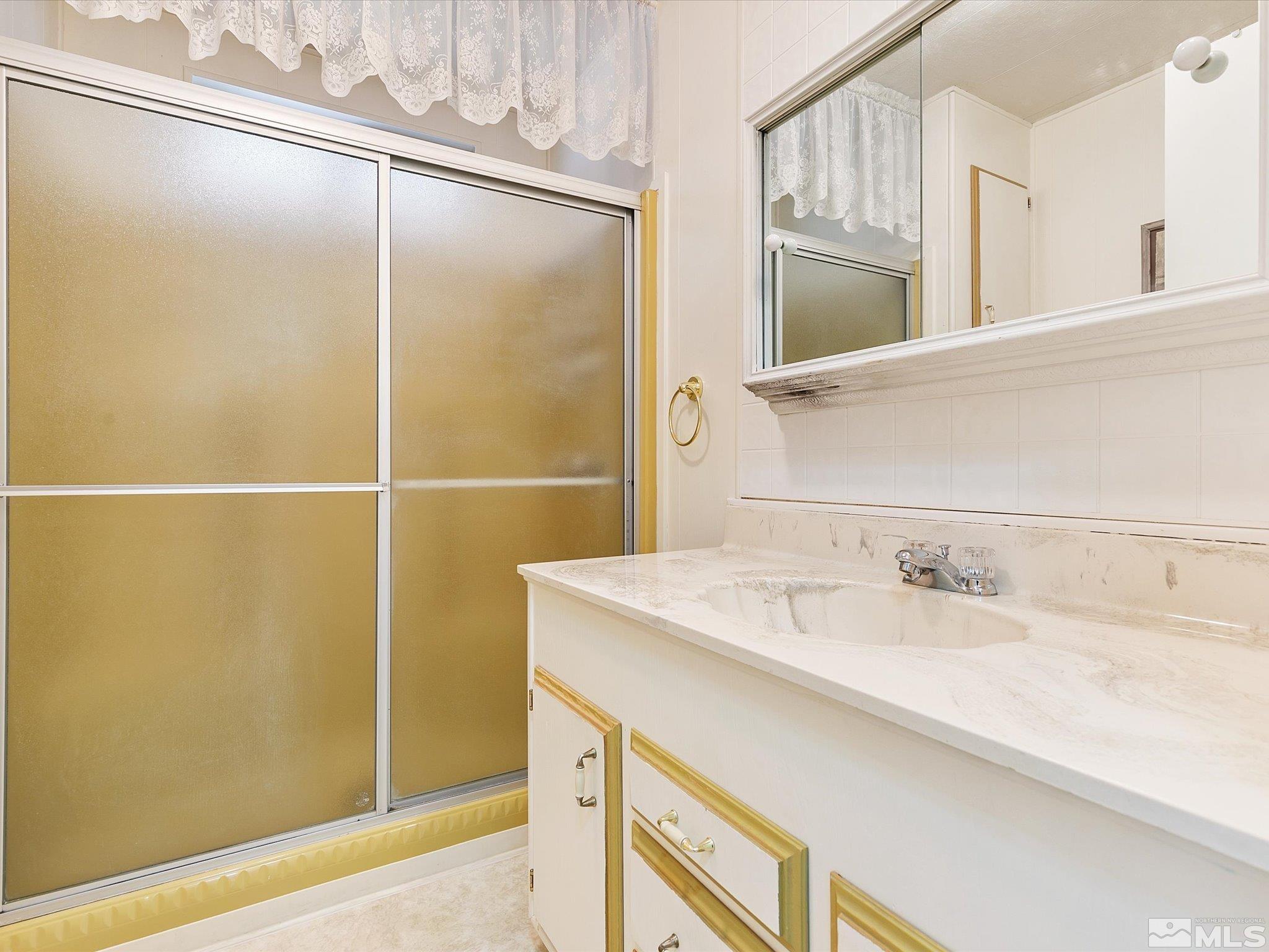 15010 Vega Street Reno, NV 89521 - Photo 23 of 30 a bathroom with a sink and a mirror
