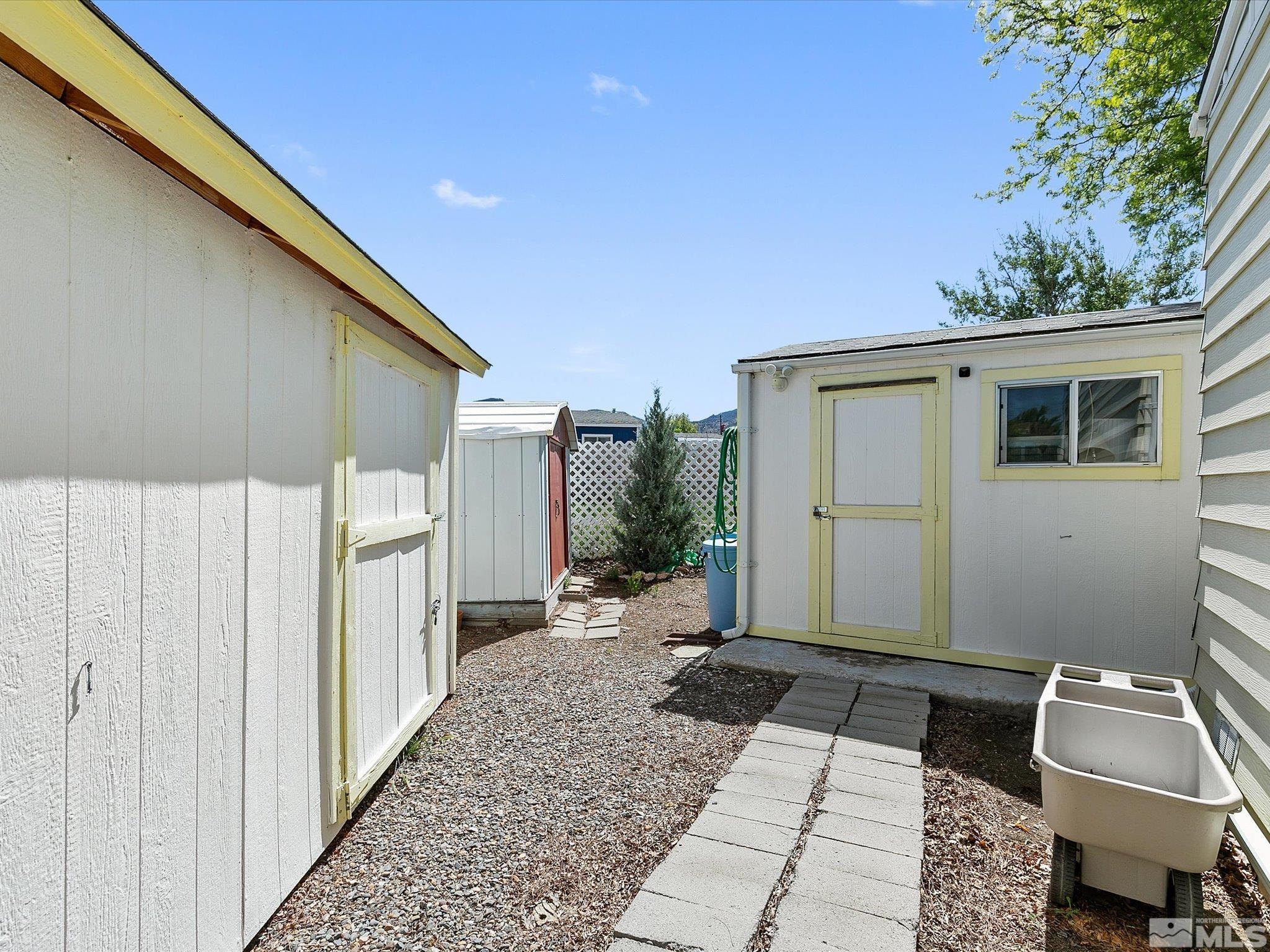 15010 Vega Street Reno, NV 89521 - Photo 29 of 30 a backyard of a house with yard and furniture