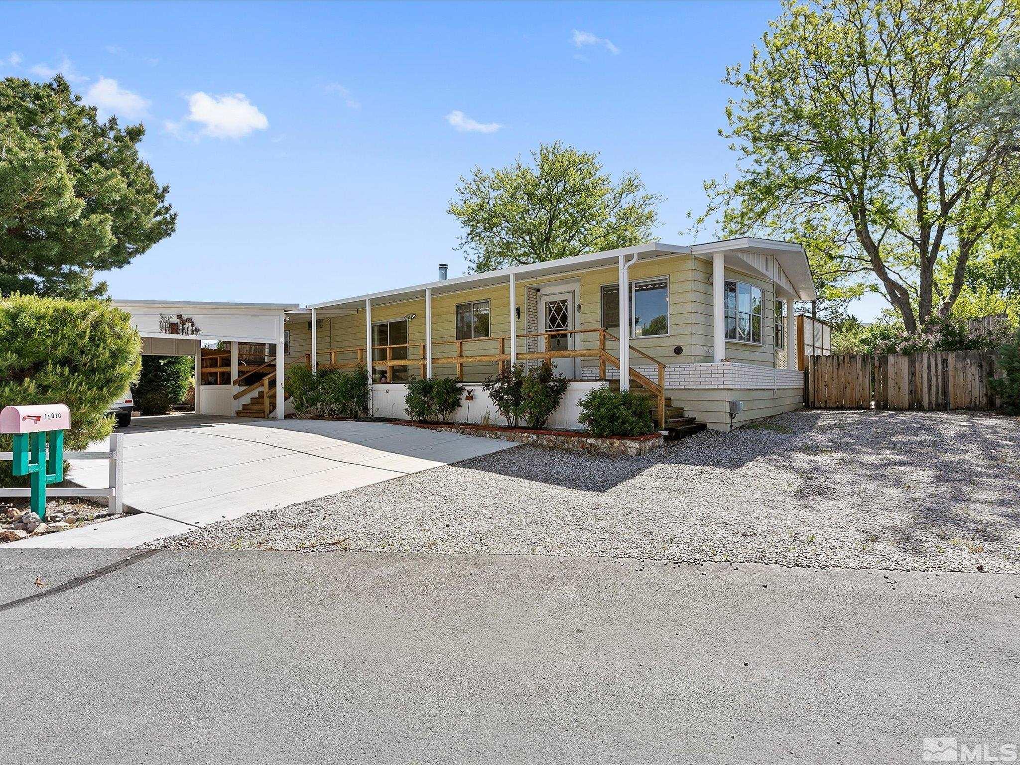 15010 Vega Street Reno, NV 89521 - Photo 4 of 30 a front view of a house with garden
