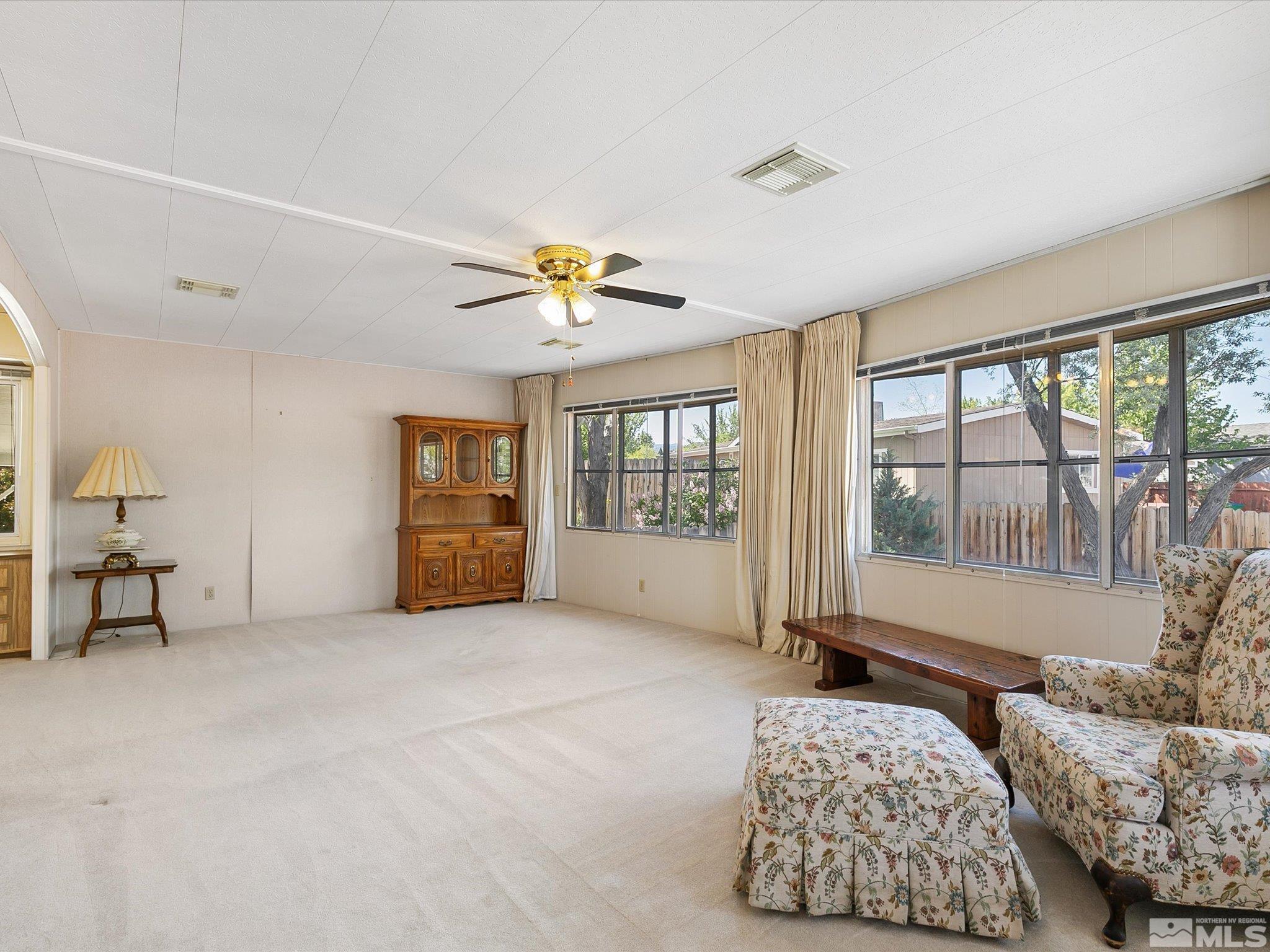 15010 Vega Street Reno, NV 89521 - Photo 6 of 30 a bedroom with furniture and large windows