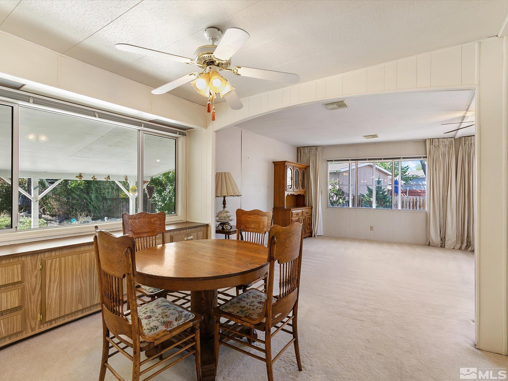 15010 Vega Street Reno, NV 89521 - Photo 9 of 30 a view of a dining room with furniture window and outside view
