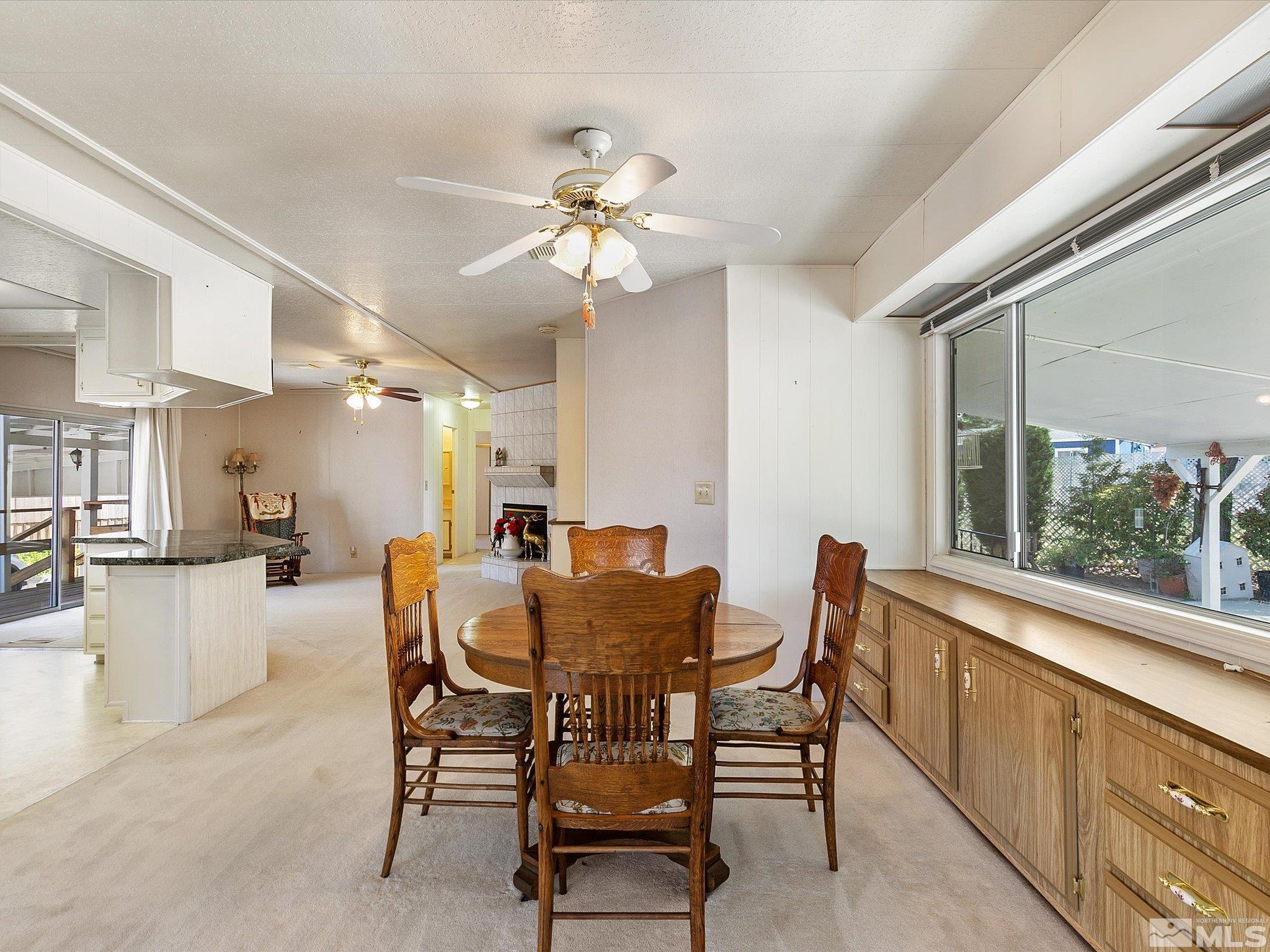 15010 Vega Street Reno, NV 89521 - Photo 10 of 30 a view of a dining room with furniture and a chandelier