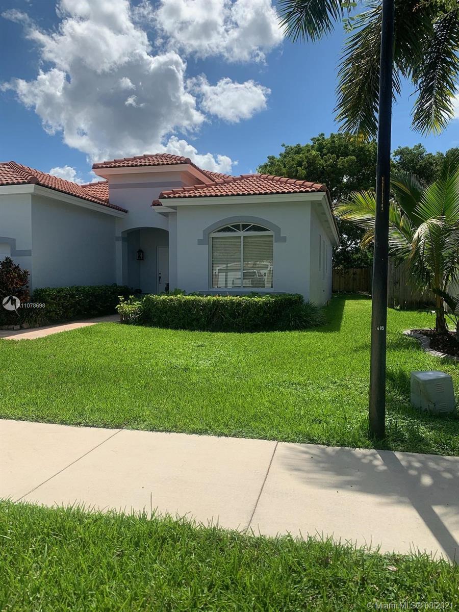 1830 Southeast 20th Road Homestead, FL 33035 - Photo 6 of 6 a front view of house with yard and green space