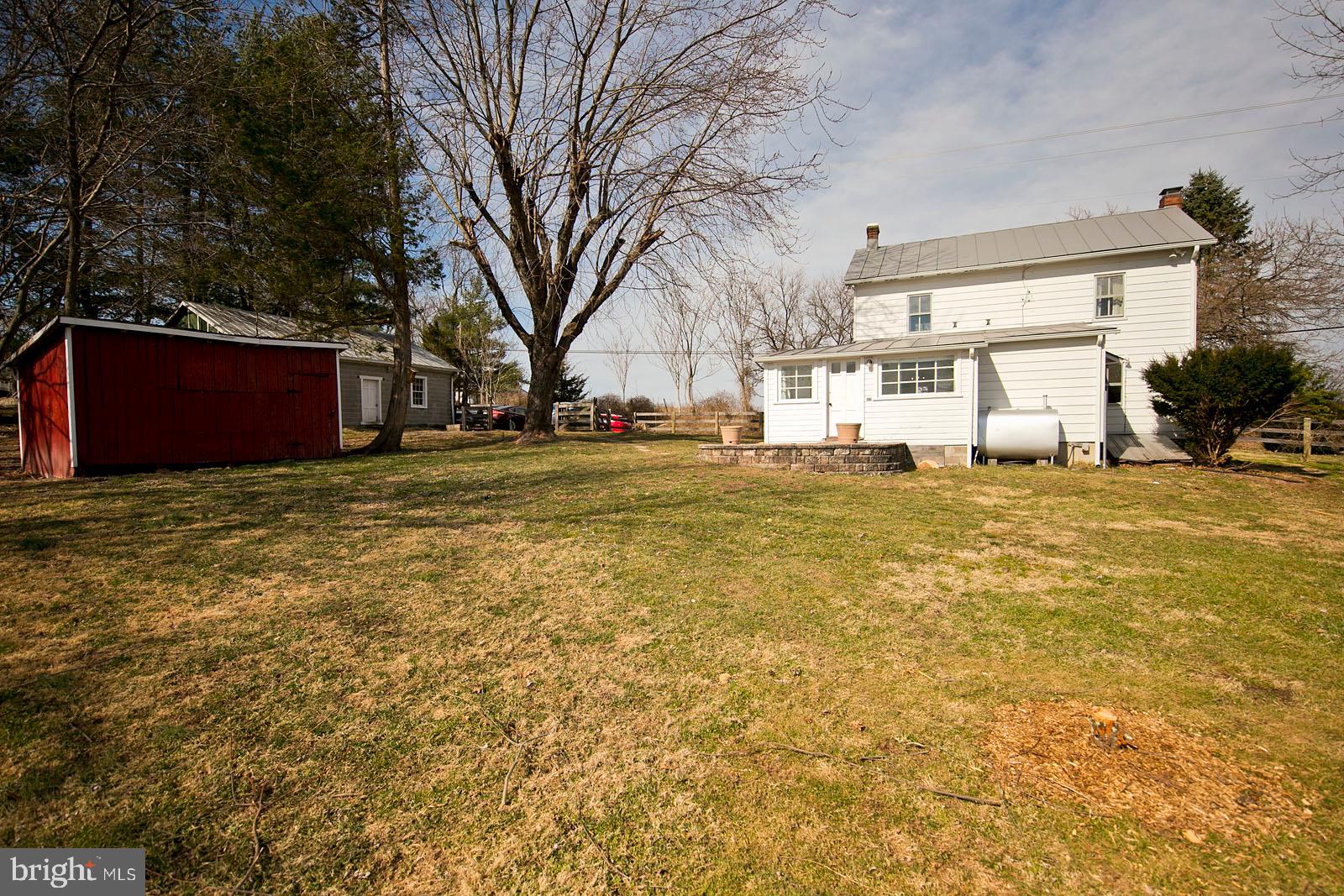 849 Redland Road Cross Junction, VA 22625 - Photo 2 of 8 a big house with trees in front of it