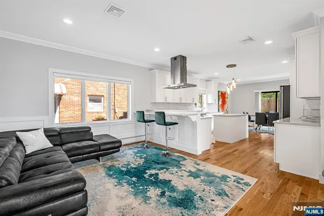 a living room with furniture a rug and a window