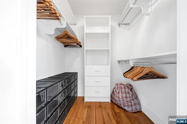 an aerial view of residential houses with outdoor space and river