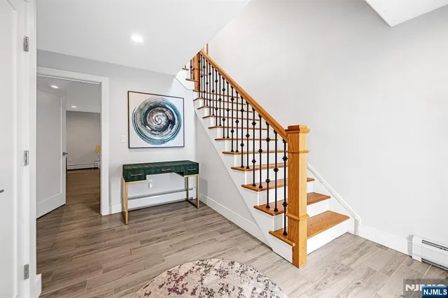 a view of entryway with wooden floor