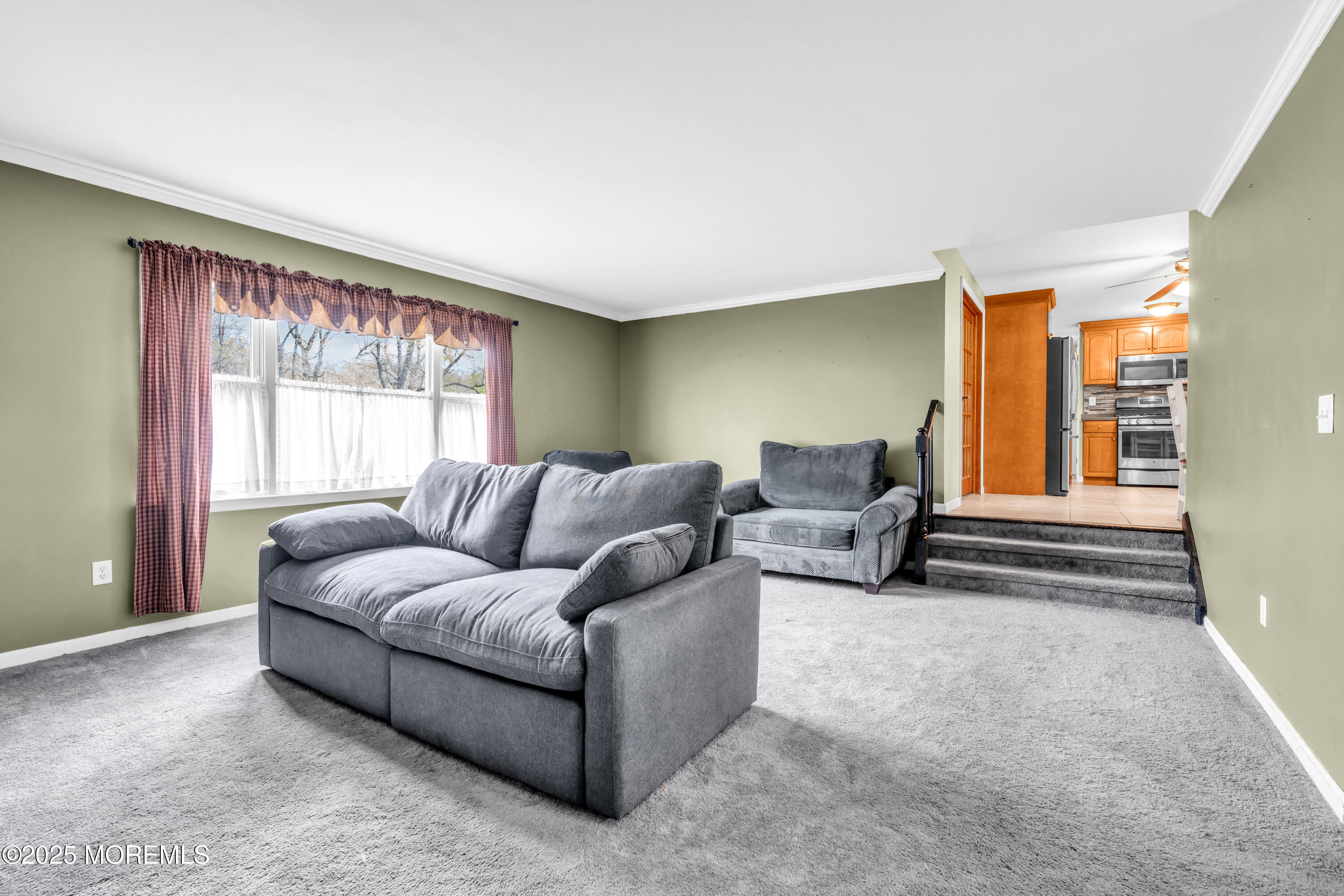 606 E Road Middletown, NJ 07748 - Photo 11 of 28 a living room with furniture and a large window