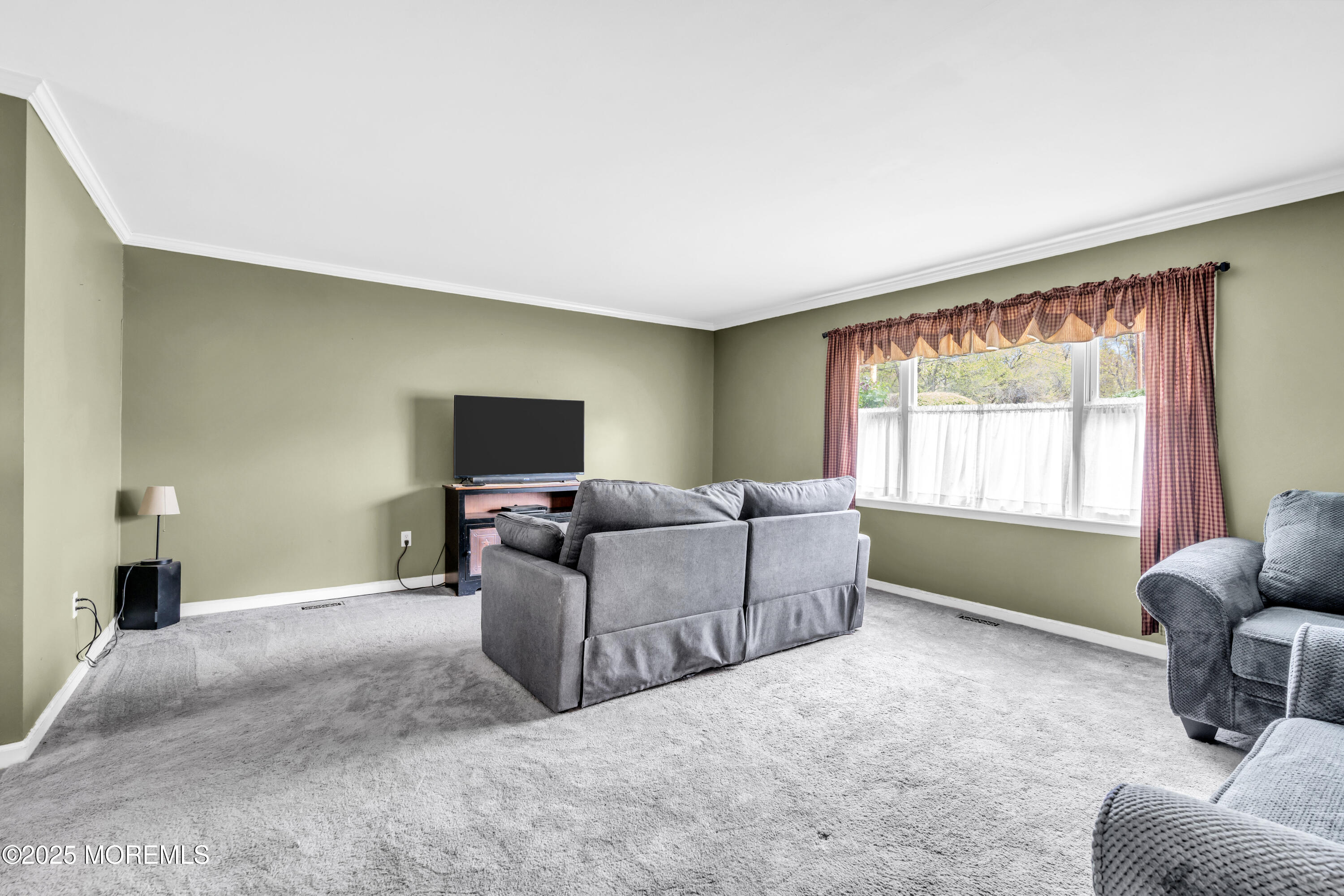 606 E Road Middletown, NJ 07748 - Photo 13 of 28 a living room with furniture and a window