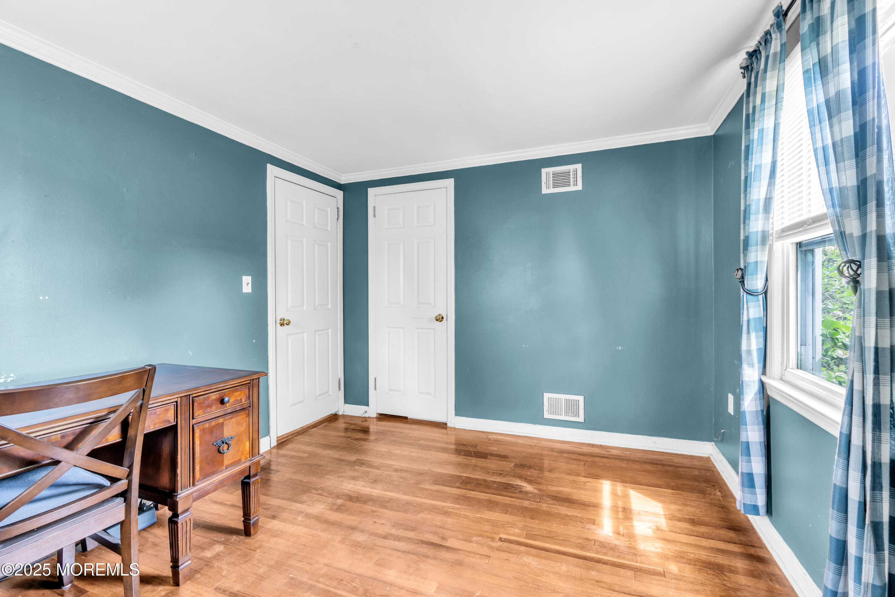 606 E Road Middletown, NJ 07748 - Photo 16 of 28 a bedroom with a bed and a window