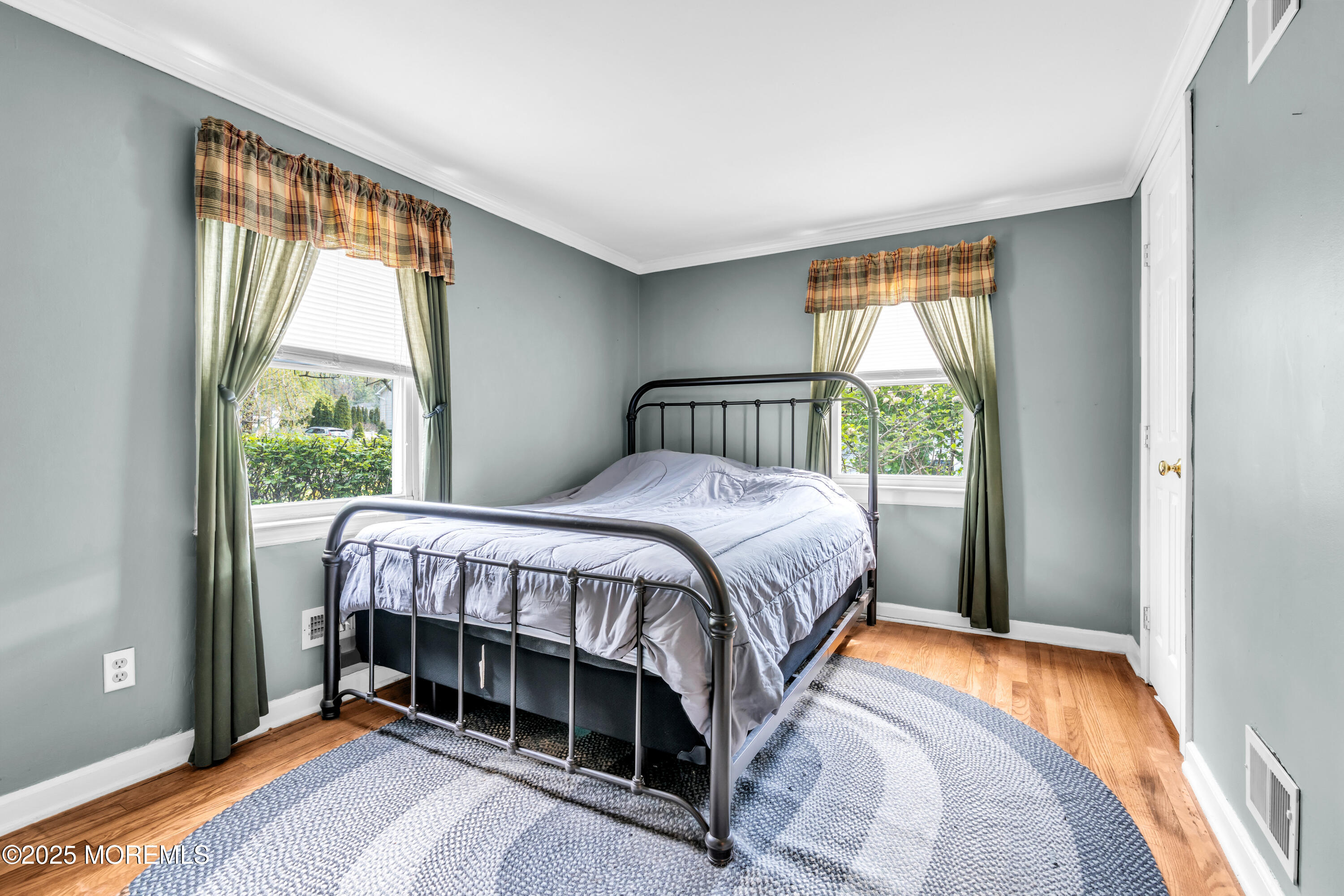 606 E Road Middletown, NJ 07748 - Photo 19 of 28 a bedroom with a bed and a window