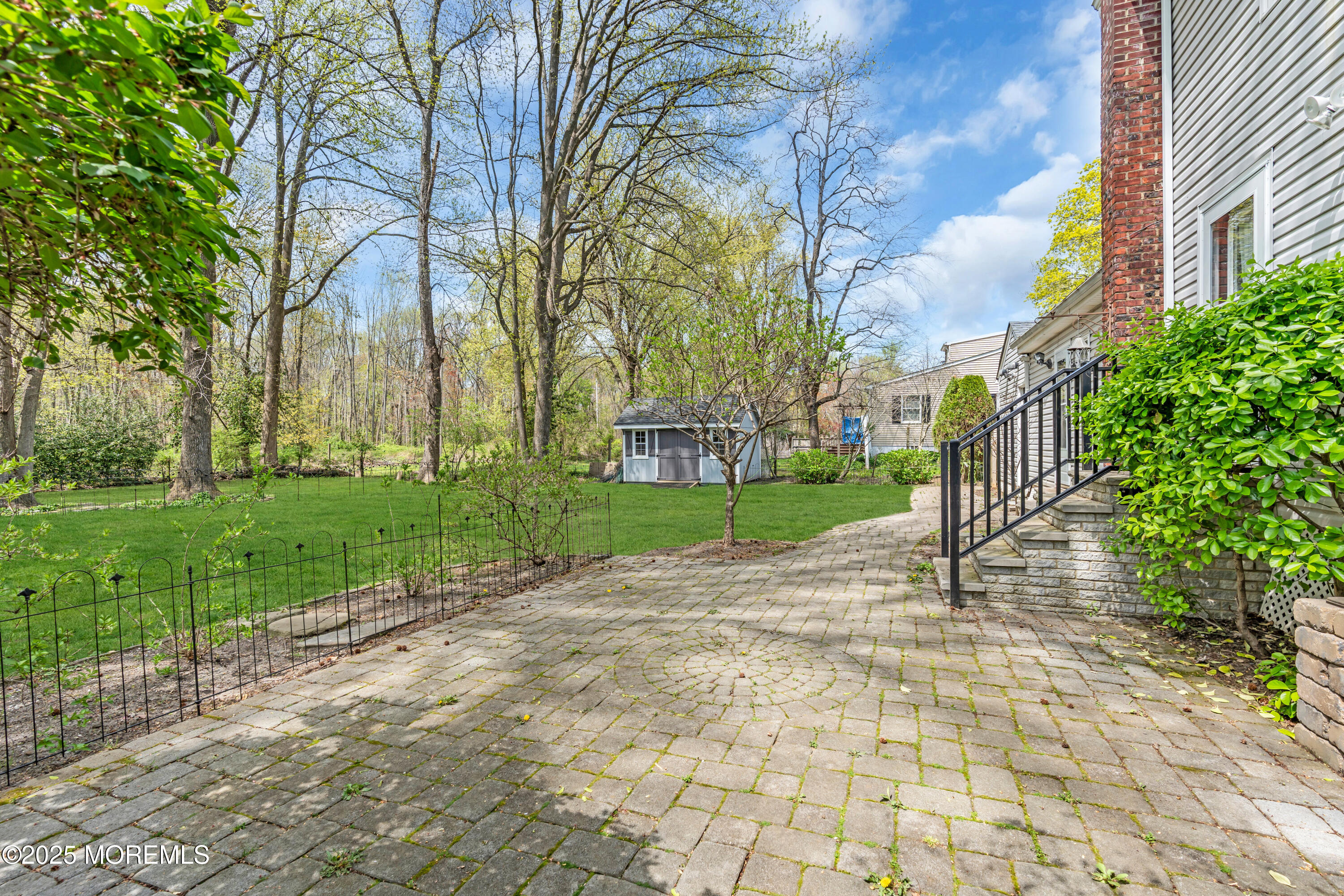 606 E Road Middletown, NJ 07748 - Photo 20 of 28 a view of a yard with plants and trees