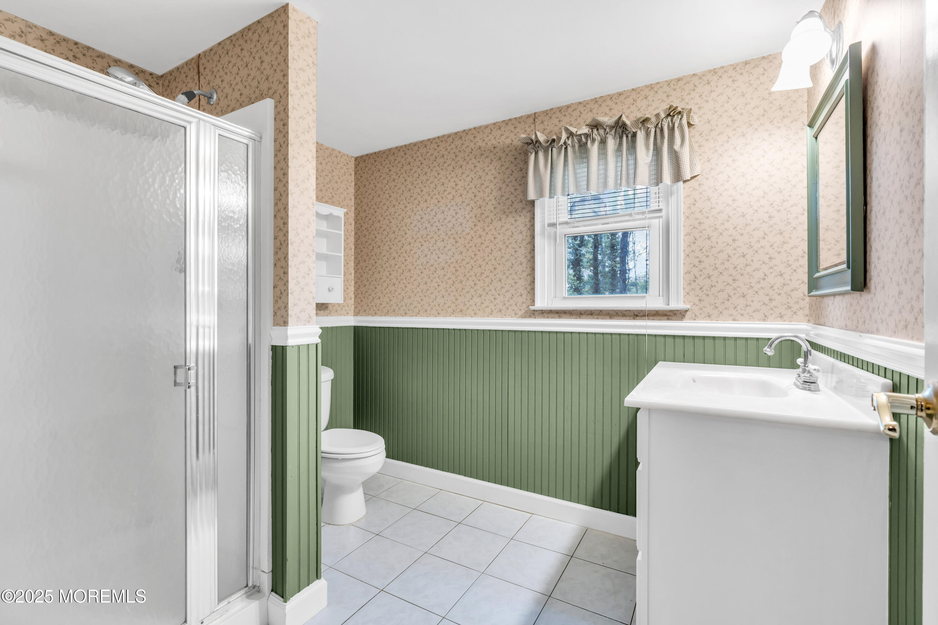 606 E Road Middletown, NJ 07748 - Photo 24 of 28 a bathroom with a sink and a mirror