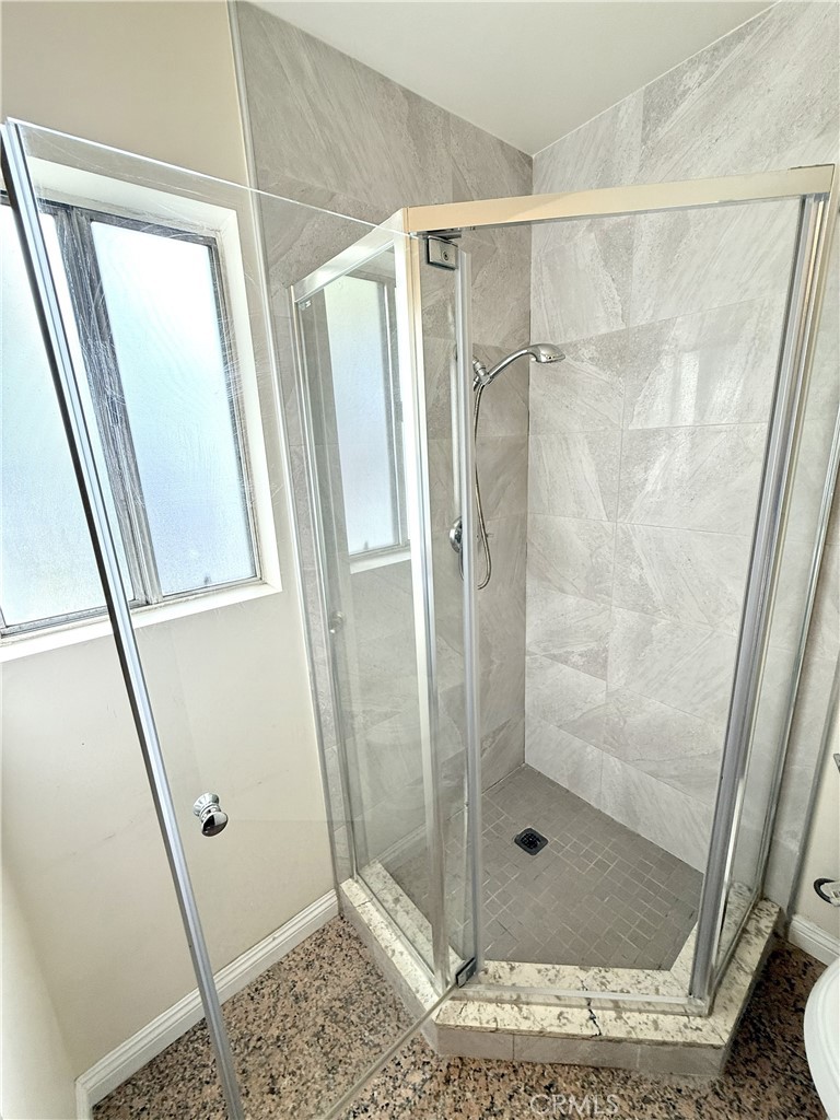 1301 South Atlantic Boulevard, Unit 234C Monterey Park, CA 91754 - Photo 19 of 27 a bathroom with a shower and toilet