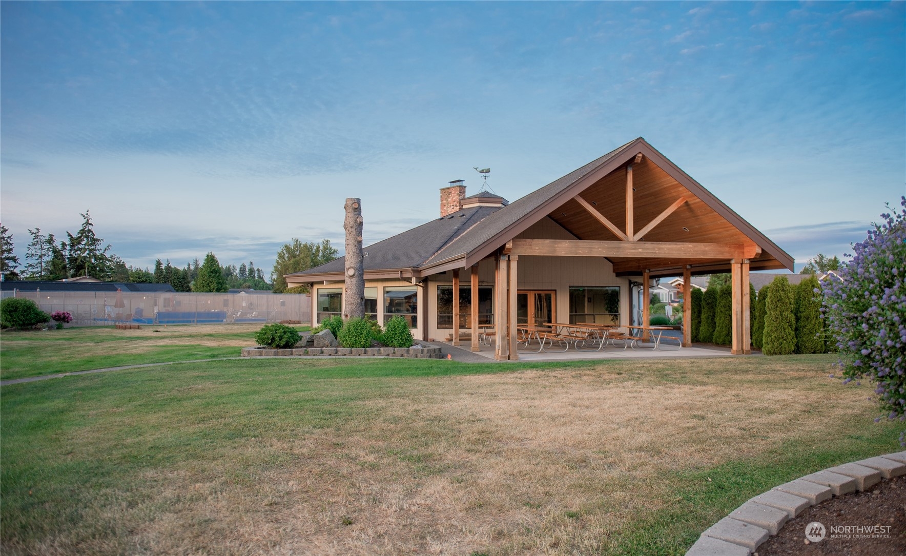 8142 Comox Loop Blaine, WA 98230 - Photo 11 of 17 a front view of a house with a yard and potted plants