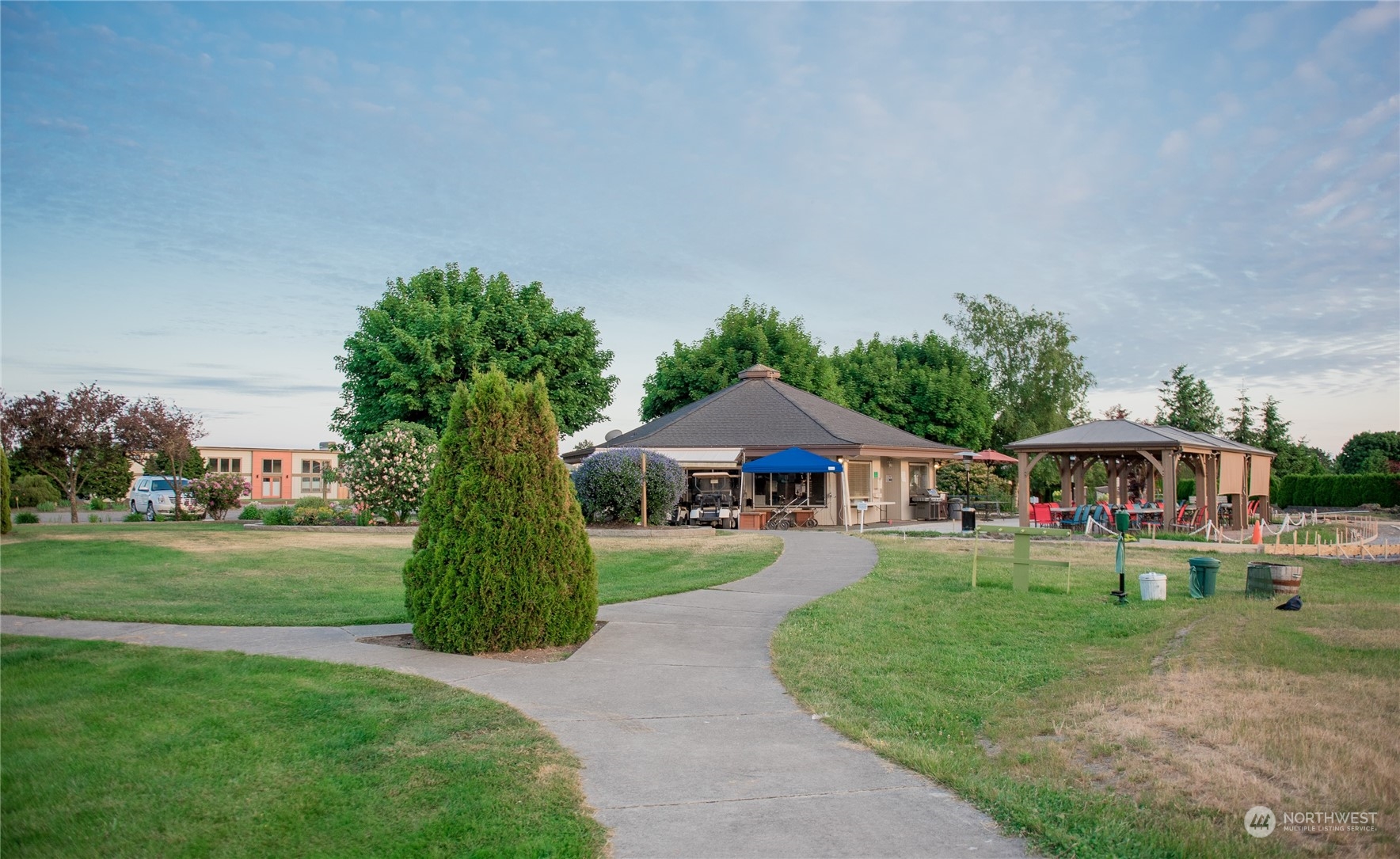 8142 Comox Loop Blaine, WA 98230 - Photo 14 of 17 a front view of a house with a yard and trees