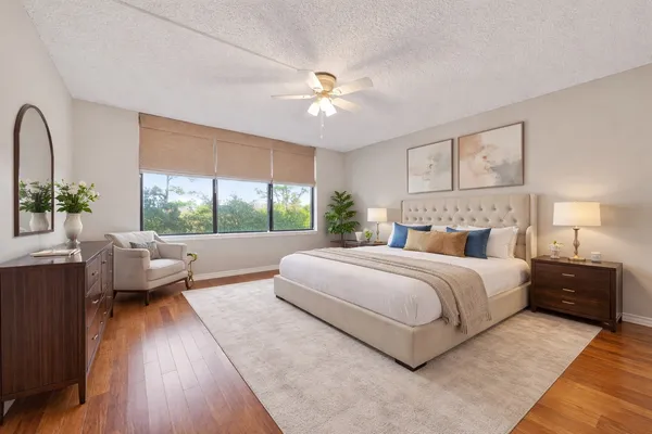 a bedroom with a large bed and a couch