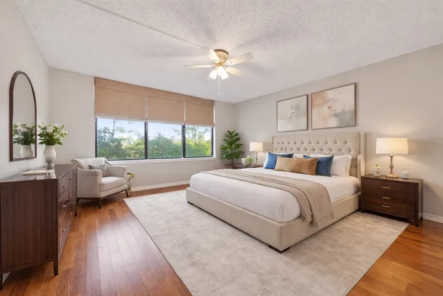 a bedroom with a large bed and a couch