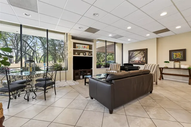 a kitchen with stainless steel appliances a stove microwave and sink