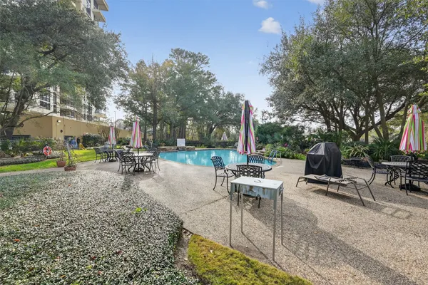 a view of a swimming pool with a yard