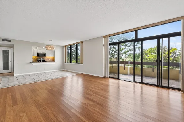a view of a livingroom with wooden floor