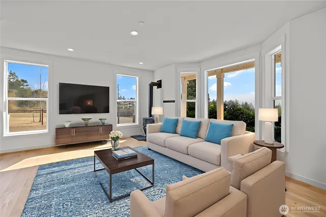a bathroom with a granite countertop sink toilet and mirror