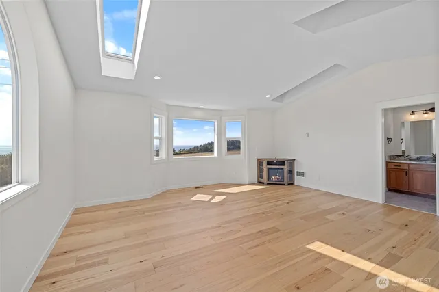 a bathroom with a granite countertop sink a mirror and a shower