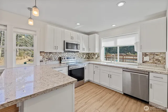 a view of room with window and wooden floor