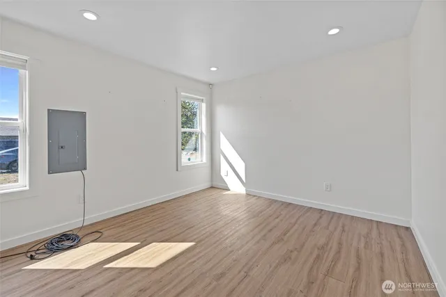 a bathroom with a granite countertop sink a toilet and shower