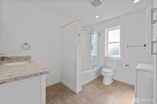 a swimming pool with outdoor seating and yard