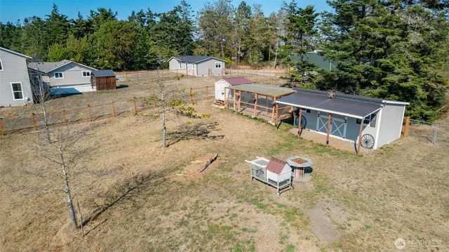 an aerial view of a house with a lake view
