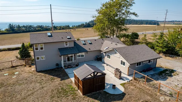 a view of backyard with a table and chairs