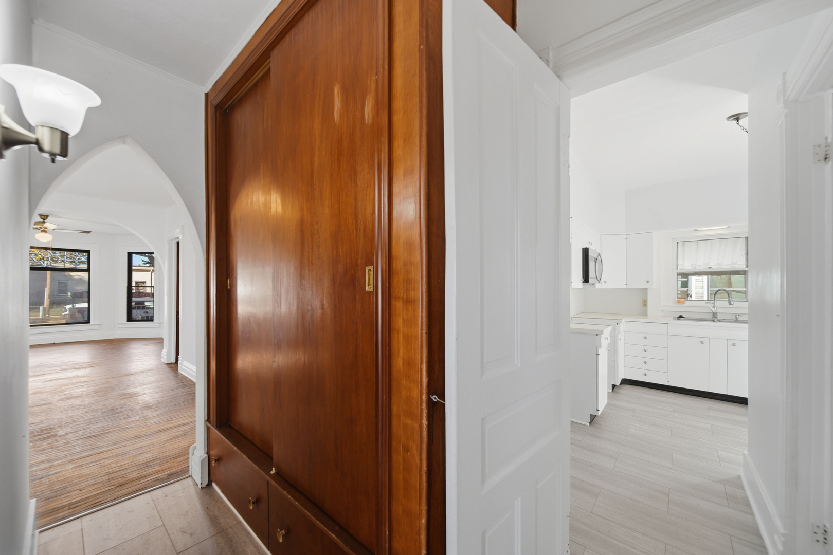 1102 West 3rd Street Dixon, IL 61021 - Photo 19 of 32 a view of a hallway with dining room and kitchen view