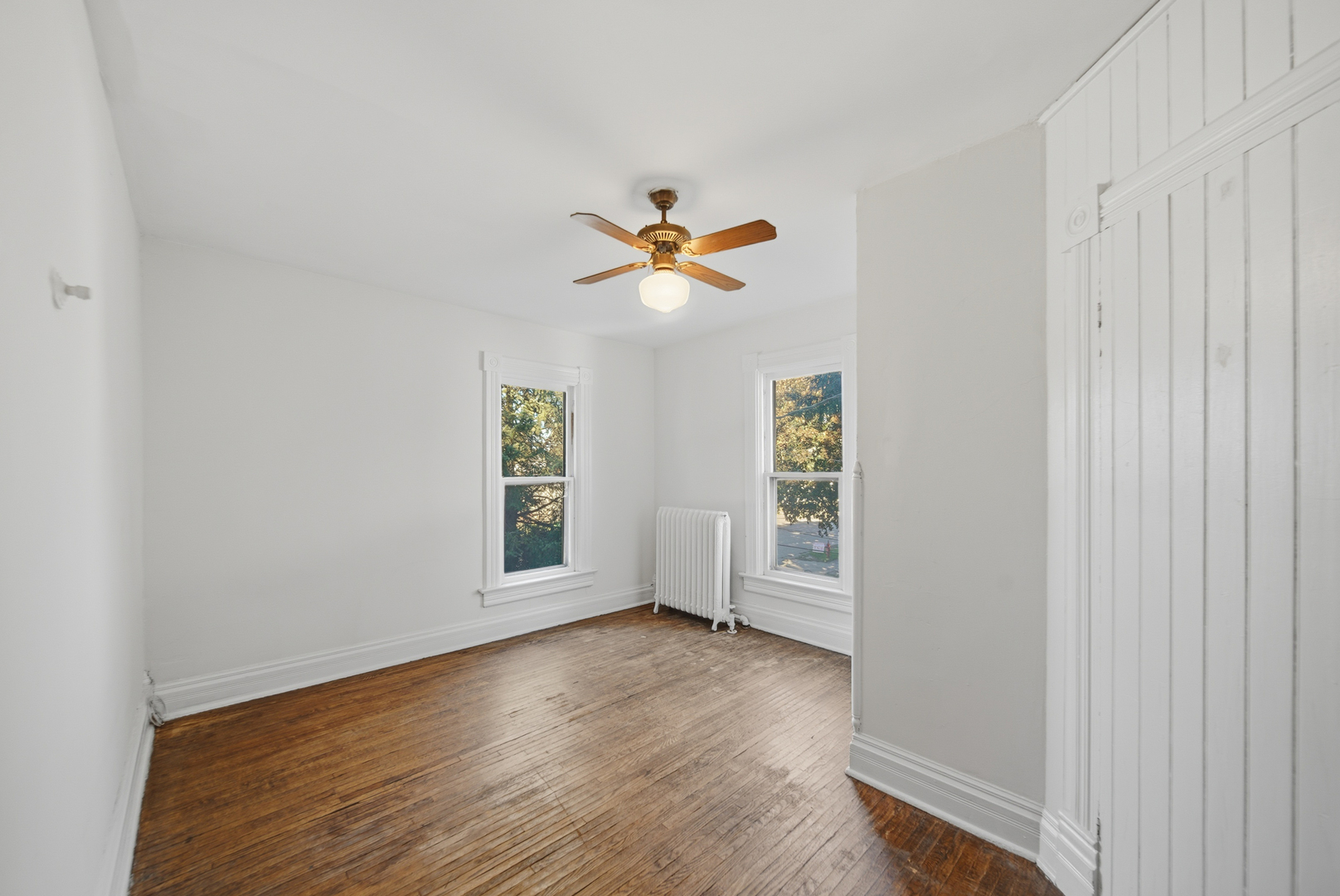 1102 West 3rd Street Dixon, IL 61021 - Photo 25 of 32 an empty room with wooden floor and ceiling fan